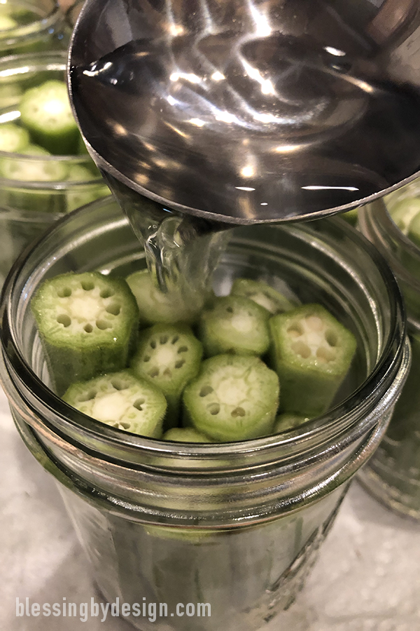 ladle vinegar mixture onto okra